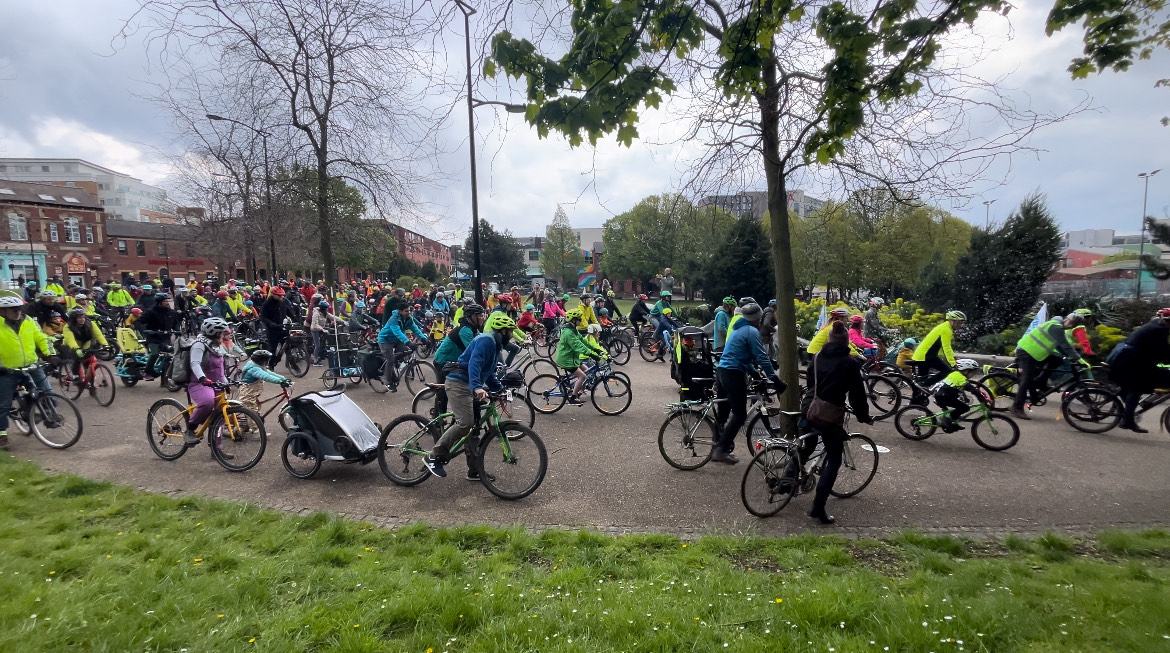 Bike riders cycling on a path together through the city