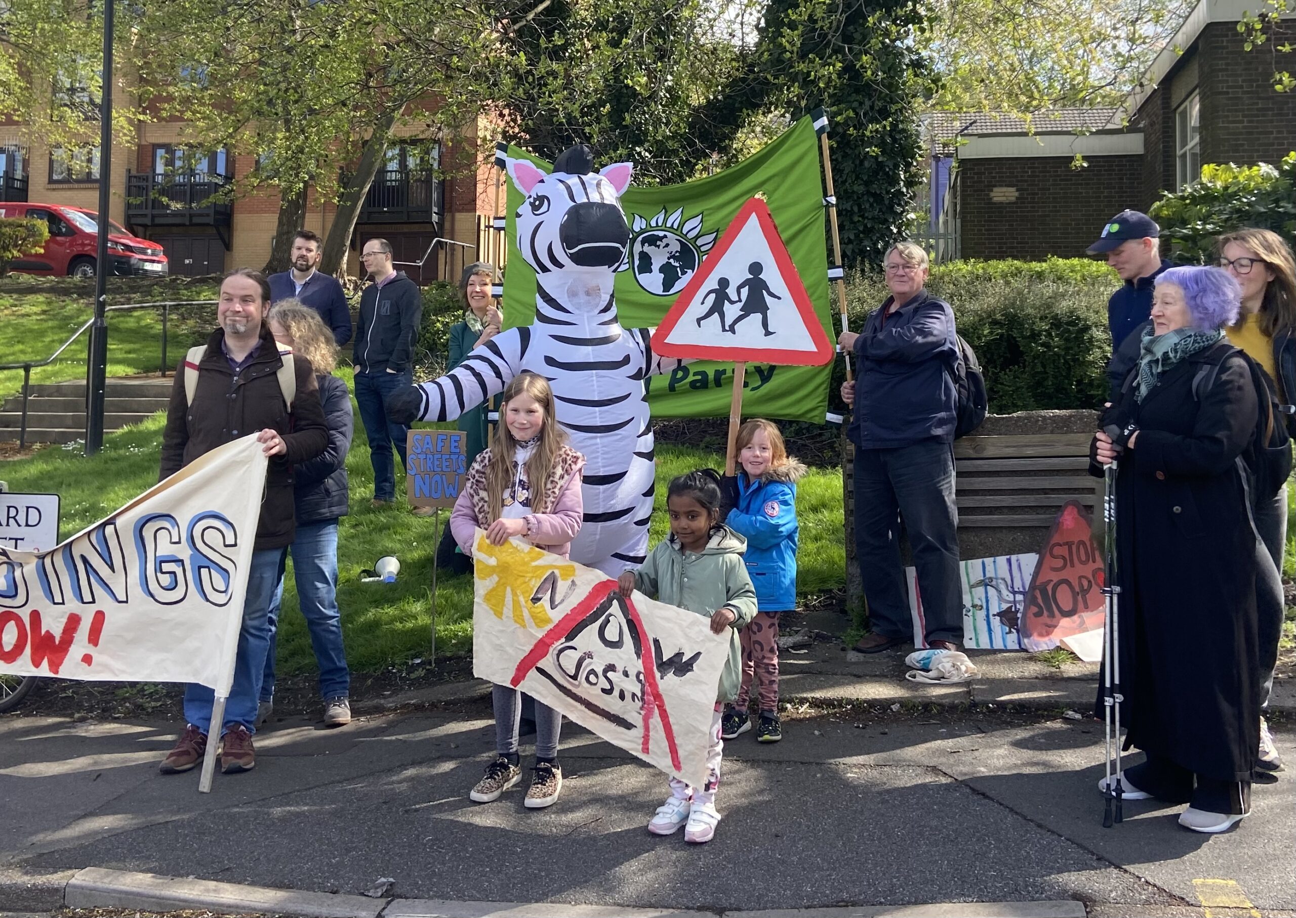 Children at a Sheffield protest, holding signs.