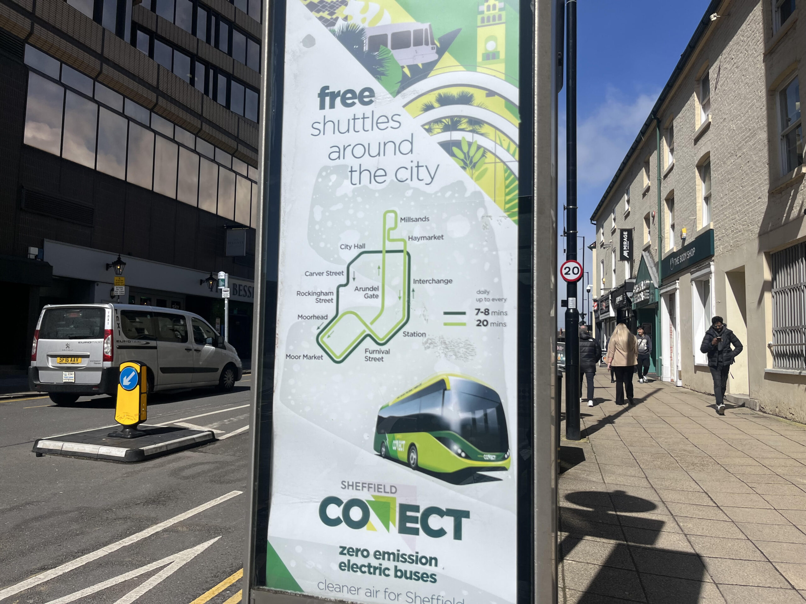 displays a bus stop poster promoting the new free electric bus service Sheffield Connect