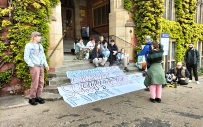 Sexual violence campaigners stage sit-in outside university building