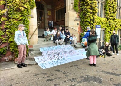Sexual violence campaigners stage sit-in outside university building