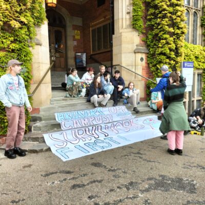 Sexual violence campaigners stage sit-in outside university building