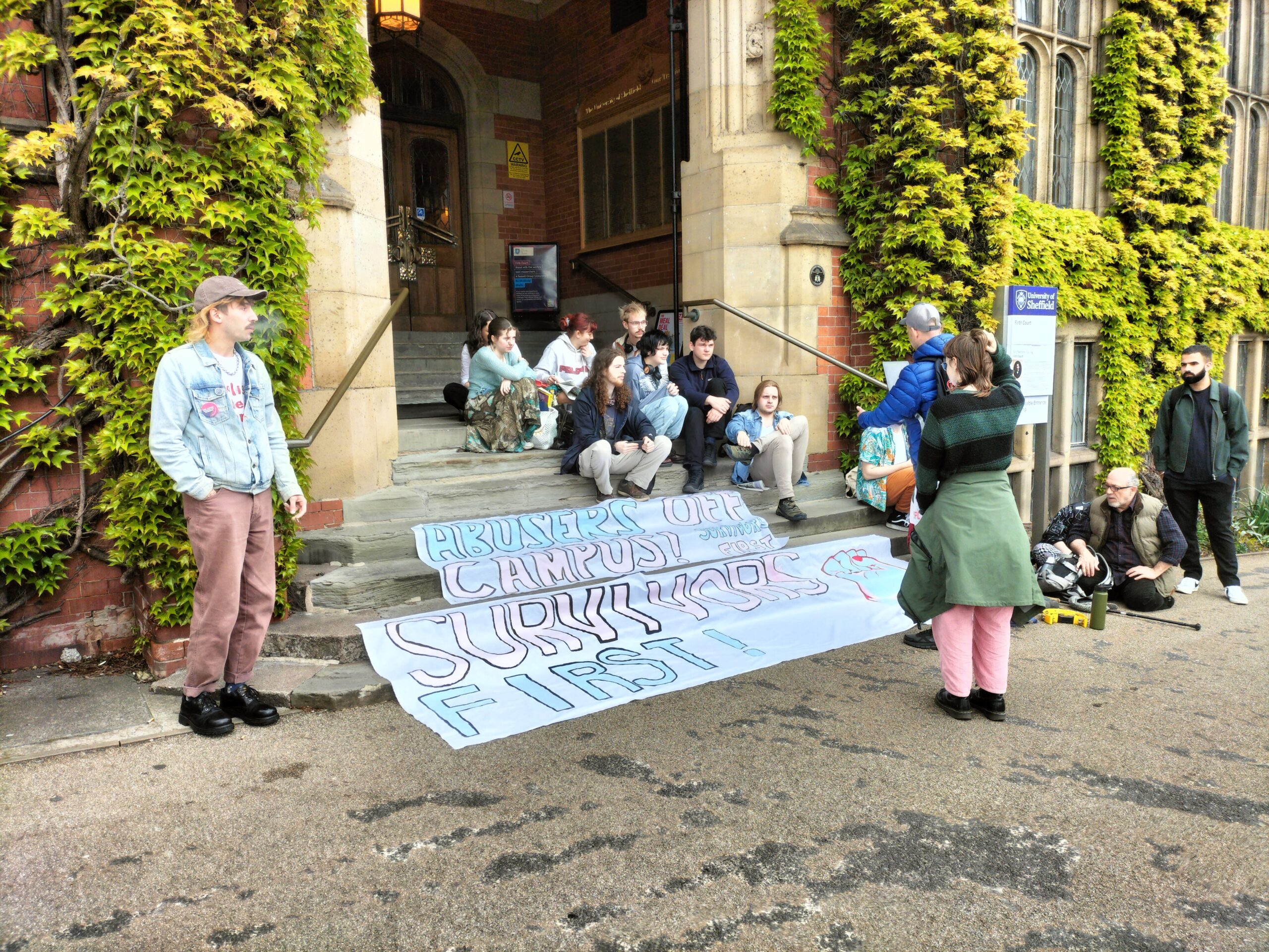 Survivors First protestors gathered on the steps of Firth Court.