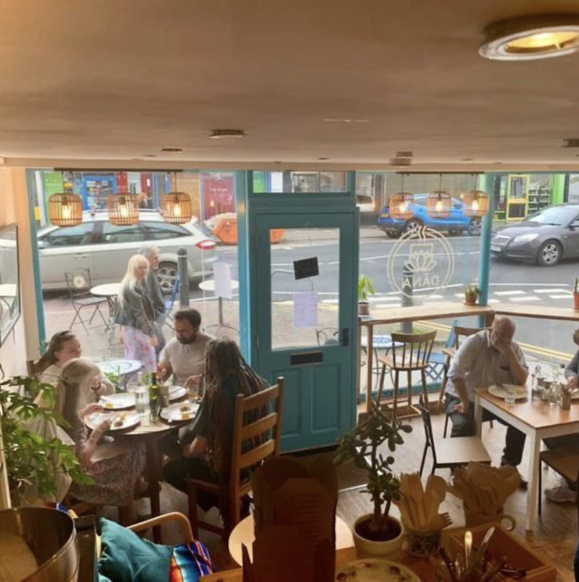 Customers inside Dāna cafe