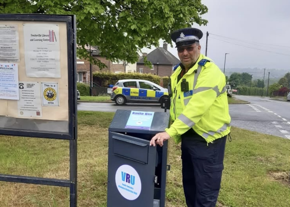 PCSO Shalome stood next to knife amnesty bin