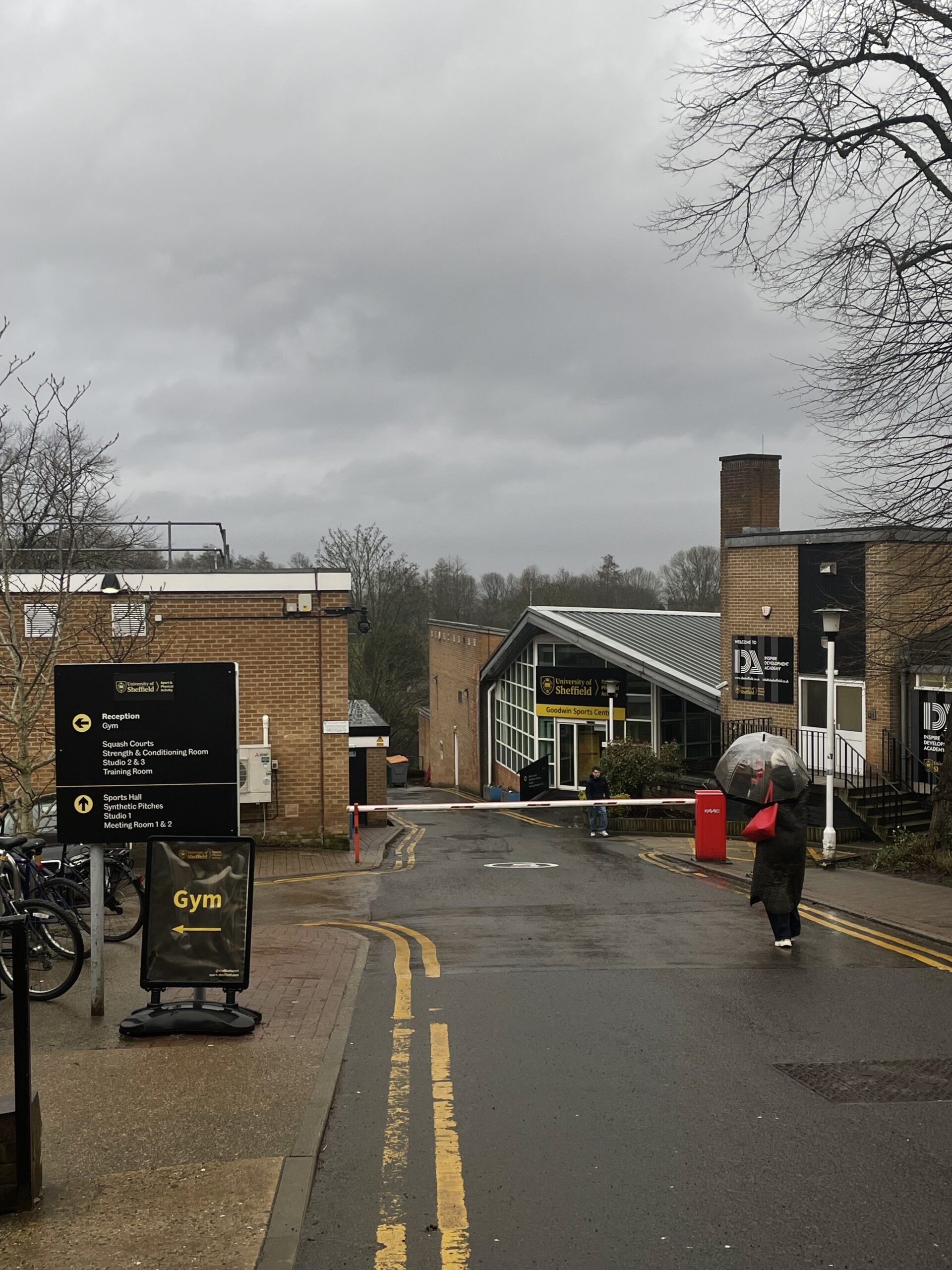 IMG_3886 Brown brick buildings at Goodwin Sports Centre, grey clouds and bare trees.